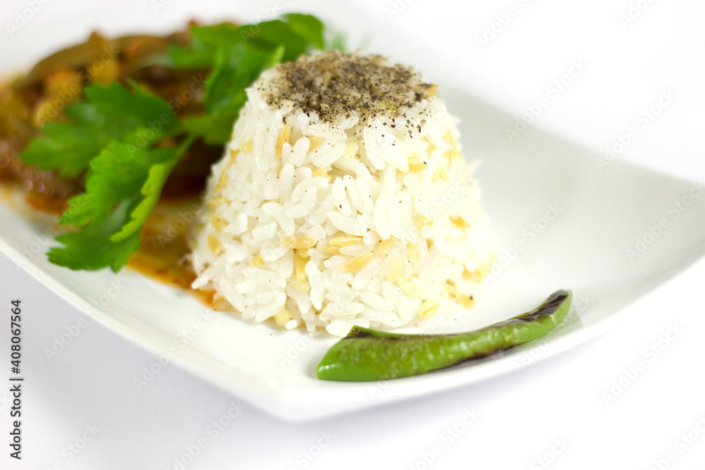 Rice pilaf and okra in a white plate Rice pilaf and okra in a white plate