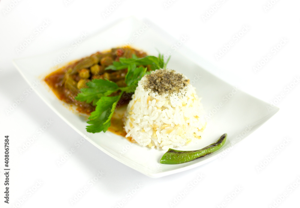 Ocra with rice and parsley in a white plate Ocra with rice and parsley in a white plate