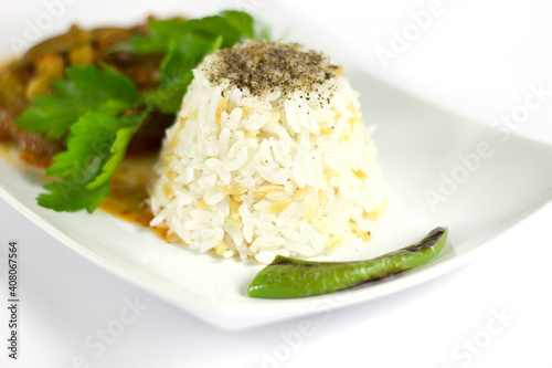 Rice pilaf and okra in a white plate