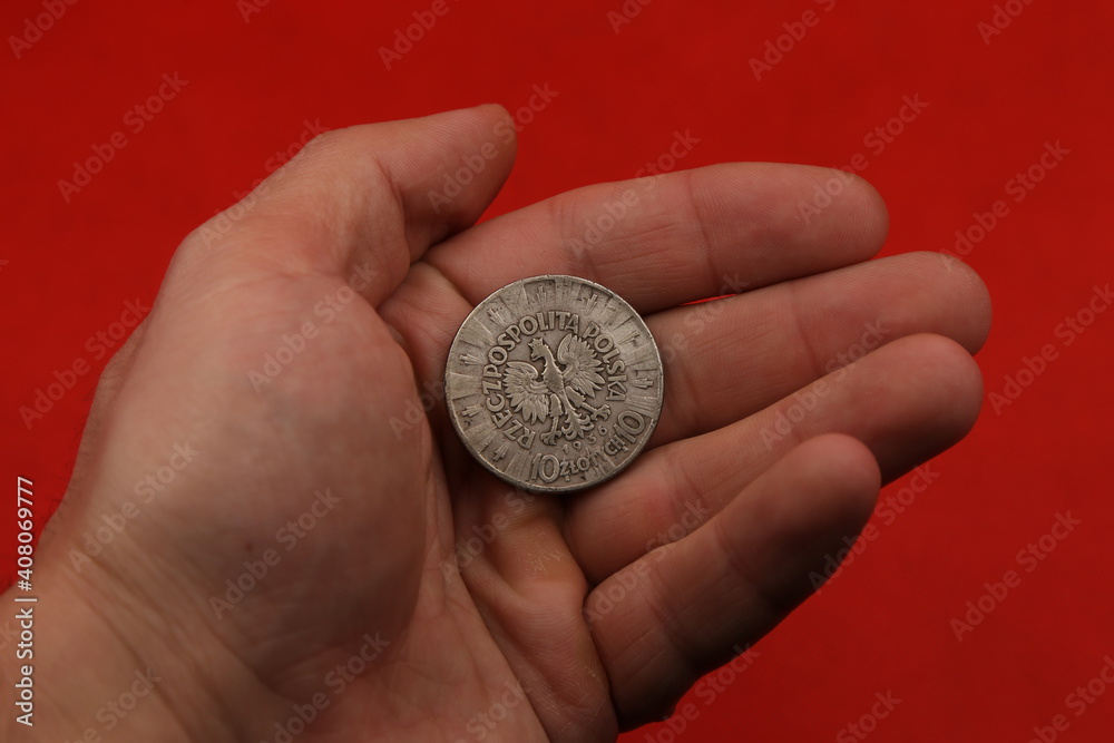 old polish silver coin in hand old polish silver coin in hand