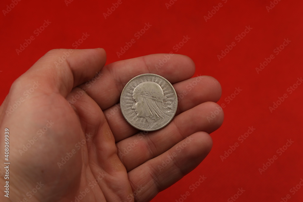 old polish silver coin in hand old polish silver coin in hand