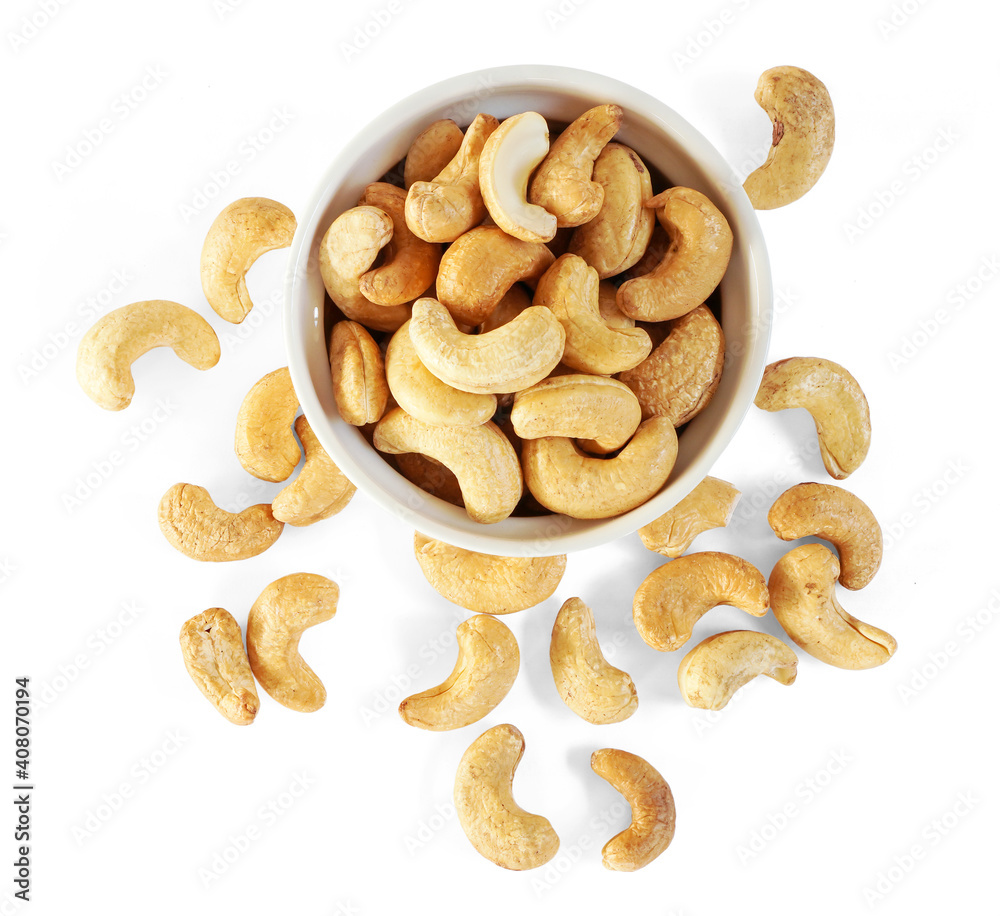 Top view of Roasted Cashew nuts in white cup isolated on white background with clipping path Top view of Roasted Cashew nuts in white cup isolated on white background with clipping path