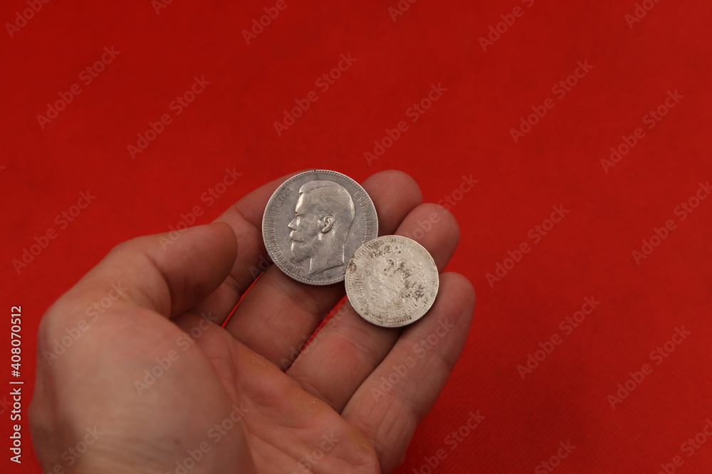 Old Russian silver coins in hand Old Russian silver coins in hand