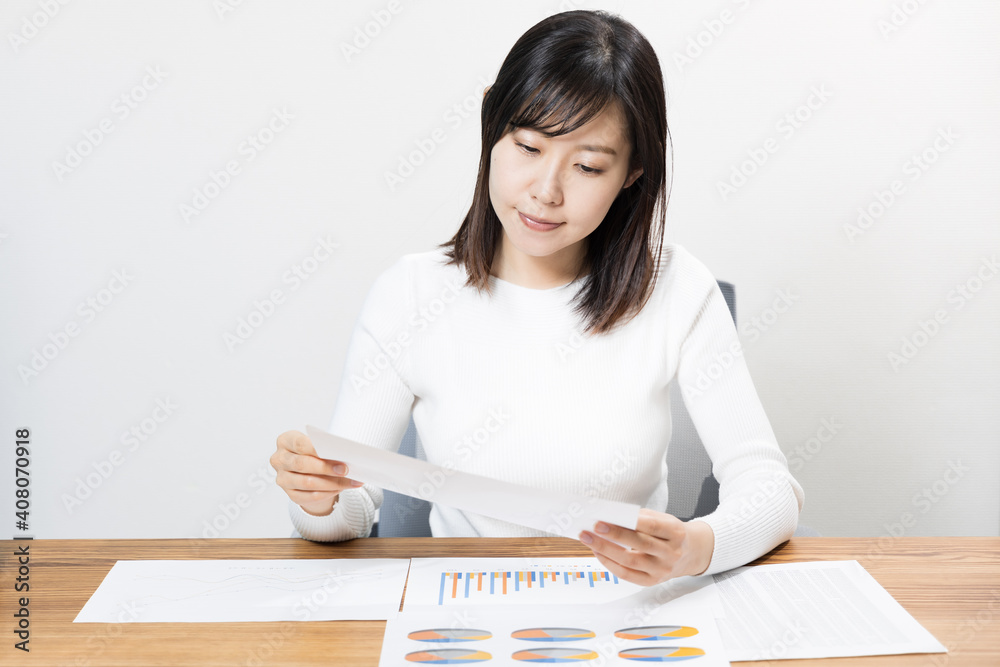 Woman viewing materials at a meeting Woman viewing materials at a meeting