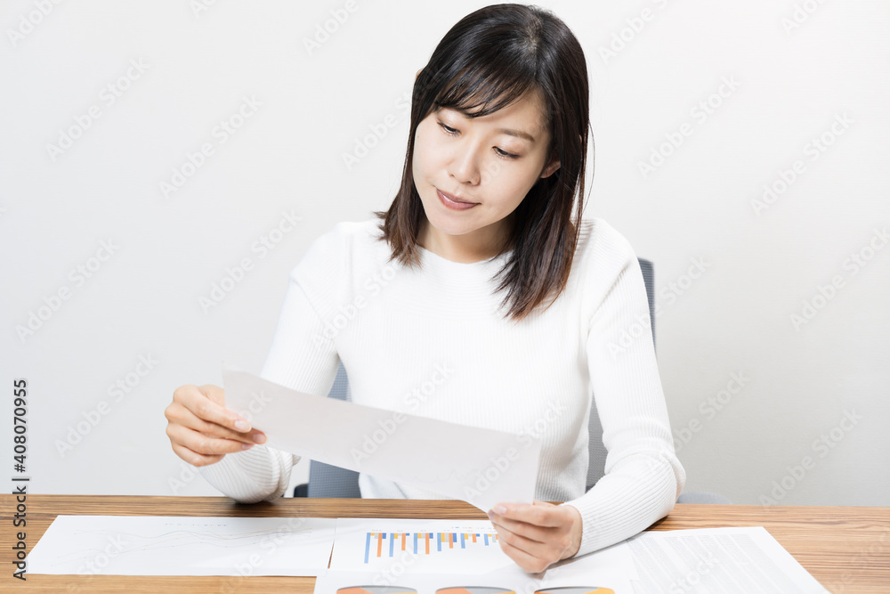 Woman viewing materials at a meeting Woman viewing materials at a meeting