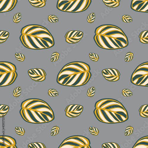 Seamless pattern of striped large leaves on a gray background. Template for printing on textiles, fabrics, bed linen, wrapping paper, covers, wallpaper. 