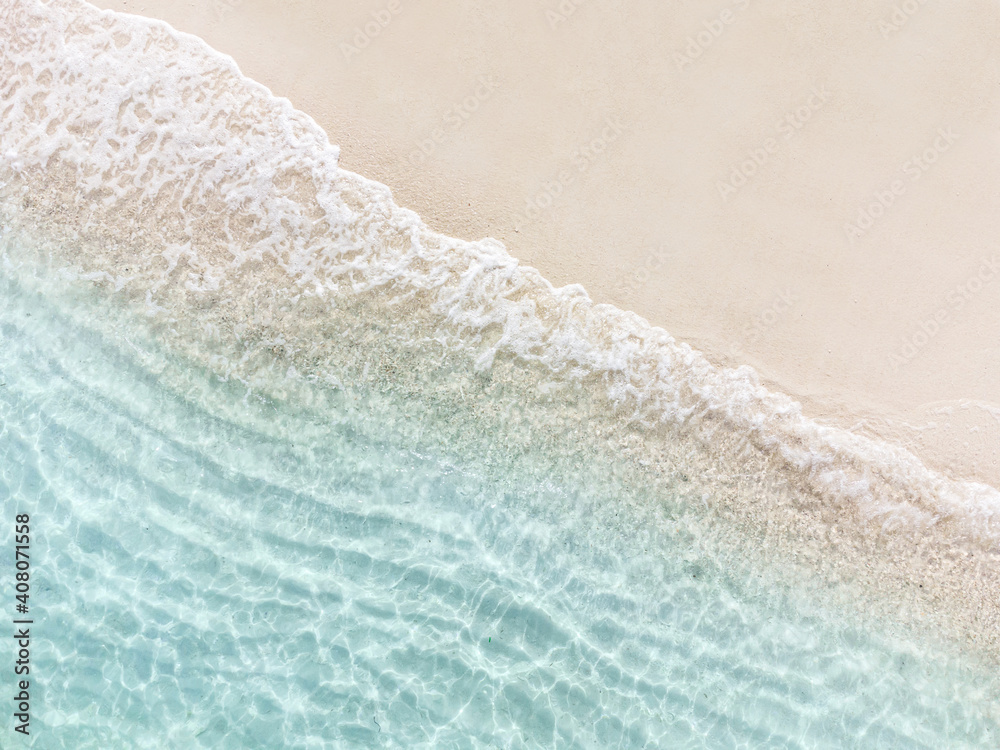 Aerial top view of beautiful tropical white sand beach with wave foam and transparent sea, Summer vacation and Travel background with copy space, Top view from drone - obrazy, fototapety, plakaty 