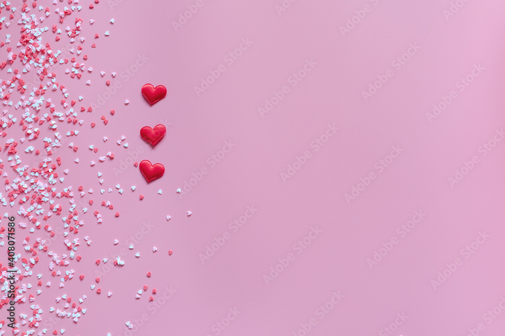 Small red, pink and white hearts on a trendy pink background. Happy Valentine's Day, Mother's Day, March 8, World Women's Day holiday card concept. Flat lay.