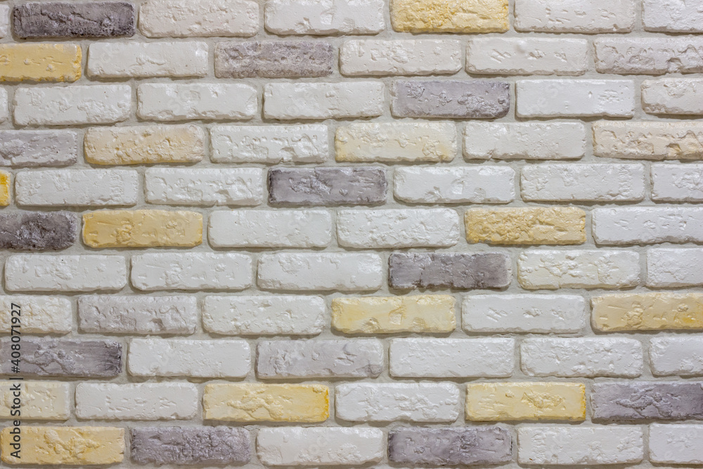 An example of facing an internal partition in a room of a house with decorative gypsum bricks with tiles in the shape of an antique wall, powder grout and colorless matte varnish An example of facing an internal partition in a room of a house with decorative gypsum bricks with tiles in the shape of an antique wall, powder grout and colorless matte varnish