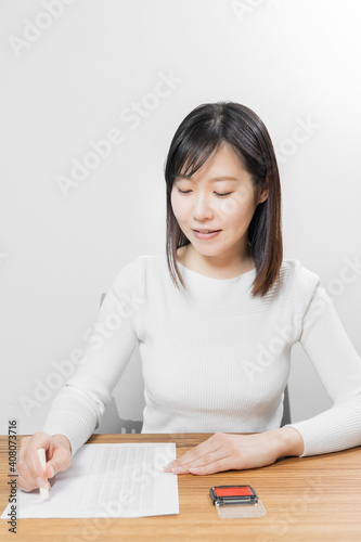 Woman stamping a name seal