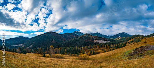 Beautiful forests covering the Carpathian mountains and a small village