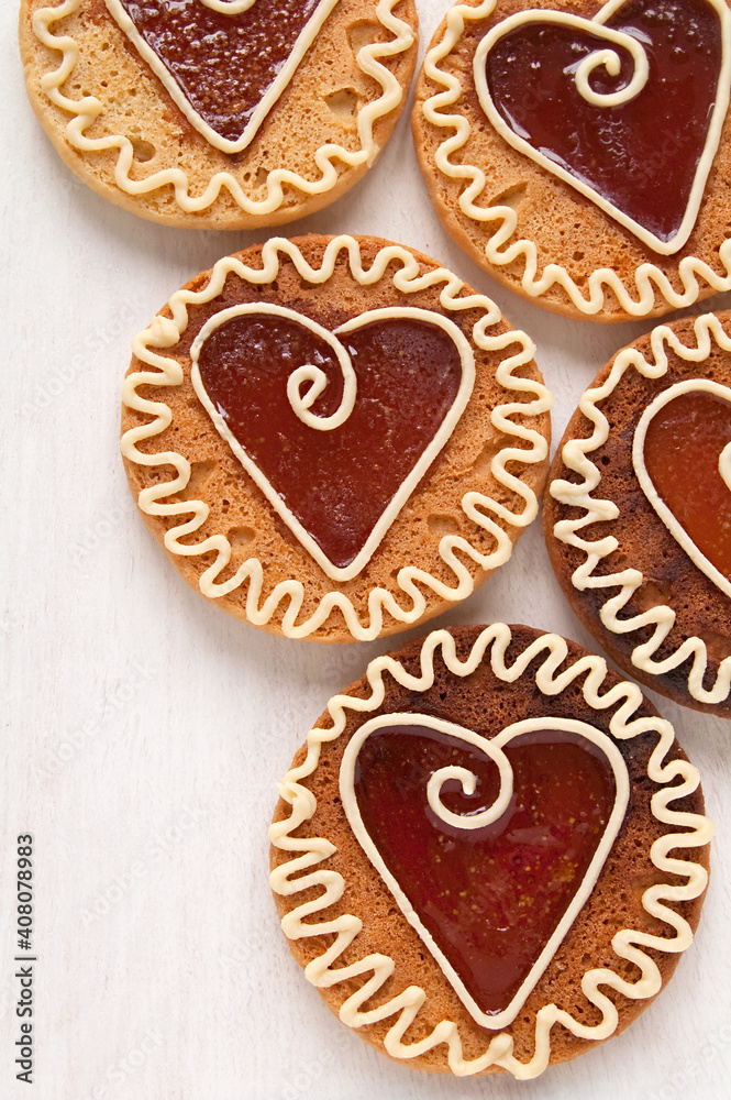 Homemade cookies with caramel in the center of the heart shaped, ornament with white chocolate Homemade cookies with caramel in the center of the heart shaped, ornament with white chocolate