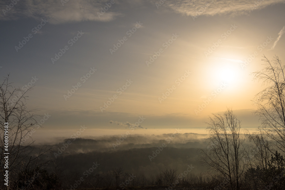 foggy morning over industrial landscape