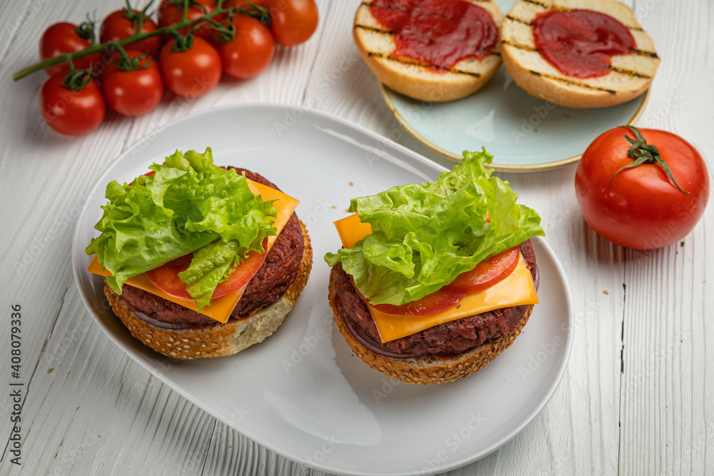Sandwiches with cutlet, salad, tomato. On a white wooden table
Sandwiches with cutlet, salad, tomato. On a white wooden table