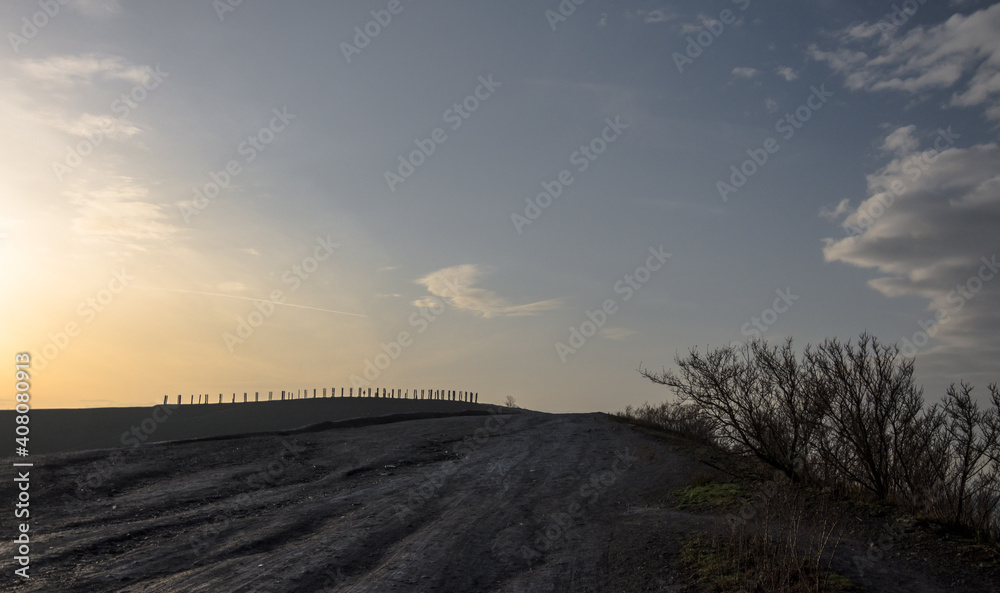 sunrise over industrial landscape