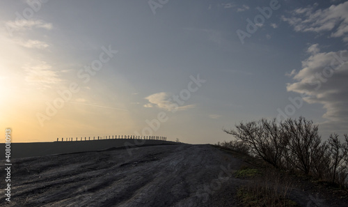 sunrise over industrial landscape