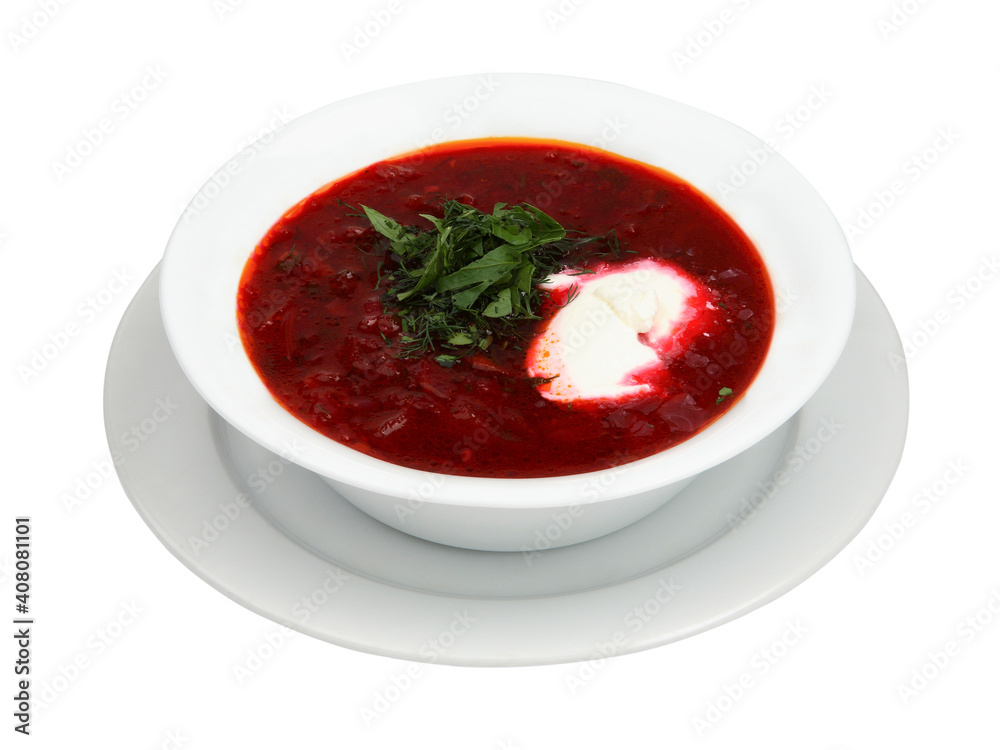 Bowl of red beetroot soup borsch on white round plate. Isolated