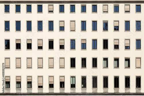 Photography facade of office building with open and closed windows