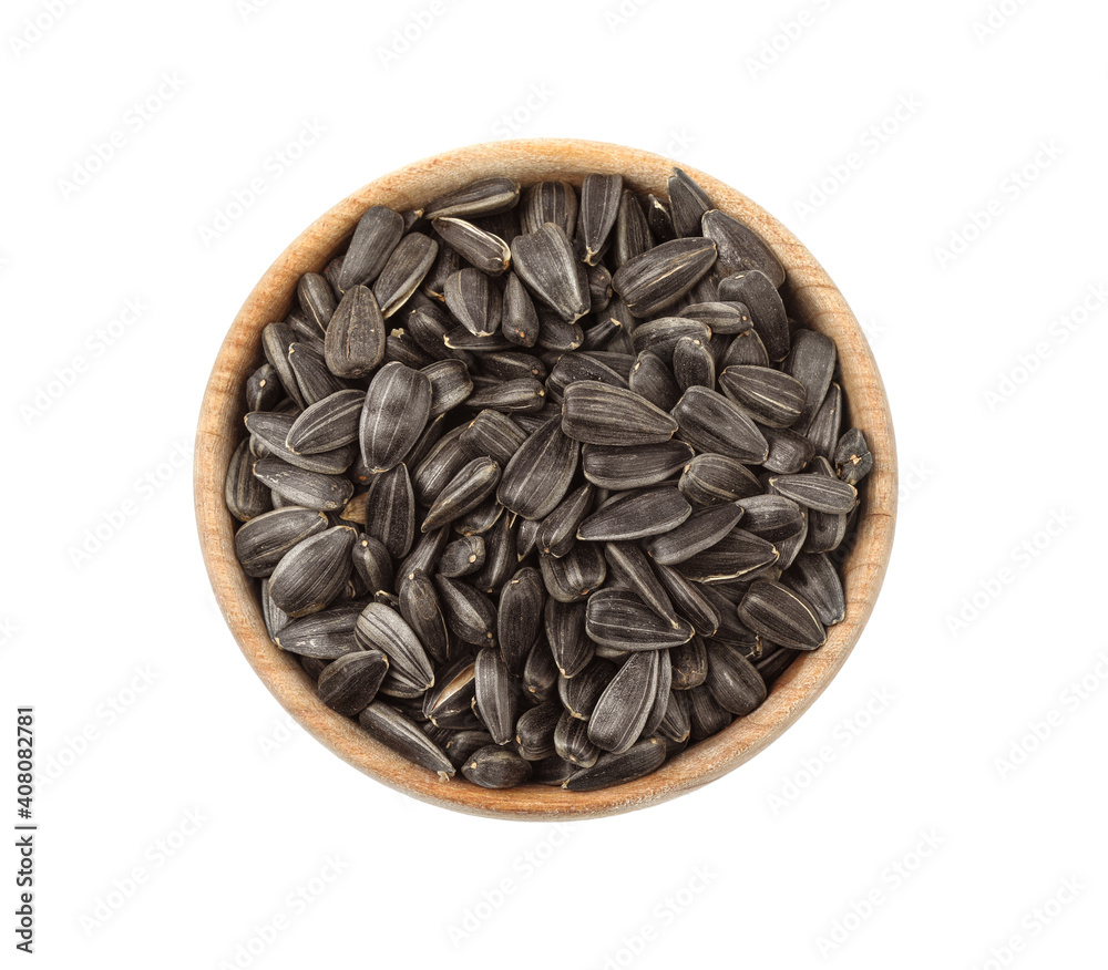 Raw organic sunflower seeds in wooden bowl isolated on white, top view Raw organic sunflower seeds in wooden bowl isolated on white, top view