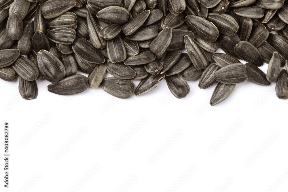 Raw sunflower seeds on white background, top view