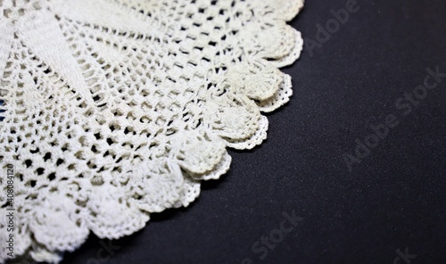 Fototapeta Naklejka Na Ścianę i Meble -  white lace fabric on black
