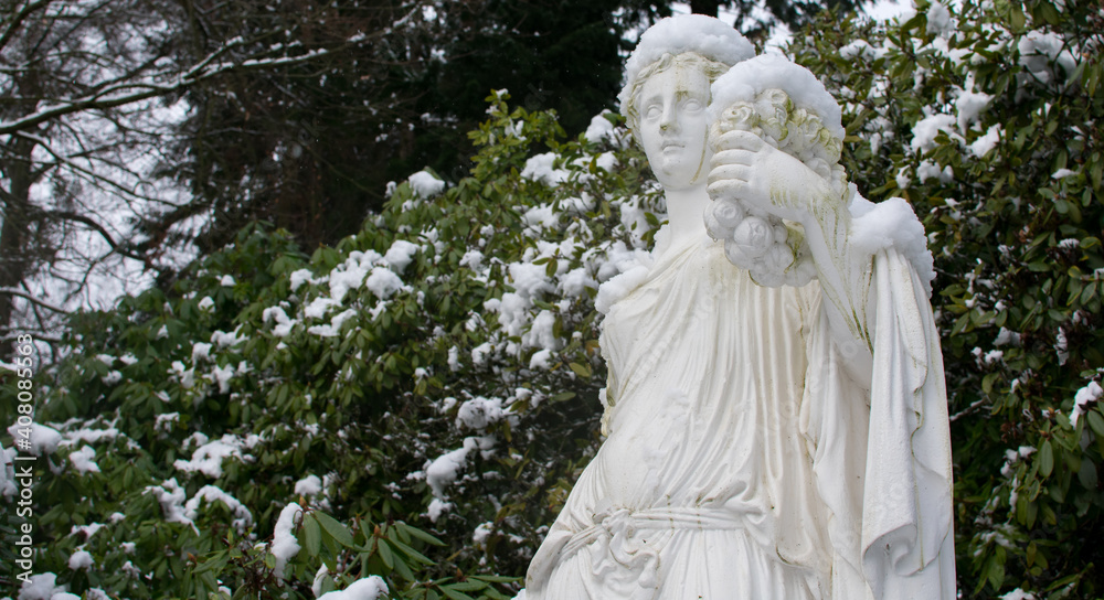 statue of a women in Park, winter Landscape