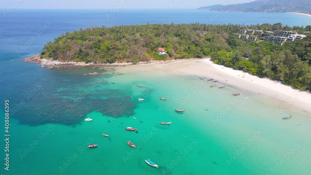 Aerial view of drone. Scene of sea and wood boat at sea. Beach sea sand at coast and mountain backdrop. Aerial view of drone. Scene of sea and wood boat at sea. Beach sea sand at coast and mountain backdrop.