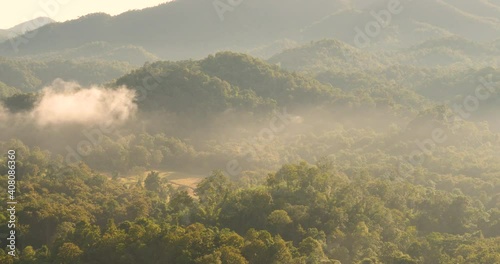 Mountain landscape foggy winndy range mountain green landscape asian farm. Beautiful landscape mountain green field meadow white cloud blue sky on sunrise. Countryside sun light heaven amazing view photo