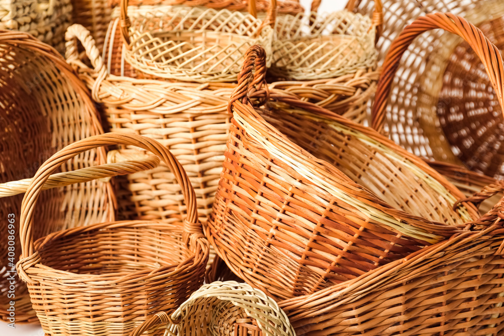Many different wicker baskets made of natural material as background Many different wicker baskets made of natural material as background