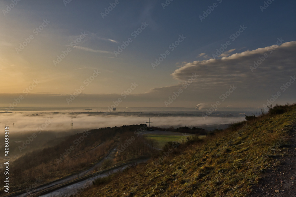 foggy morning over industrial landscape