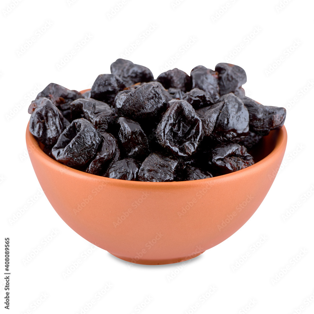 Dried plums or prunes in brown bowl isolated on white background, copy space. Dried plums or prunes in brown bowl isolated on white background, copy space.