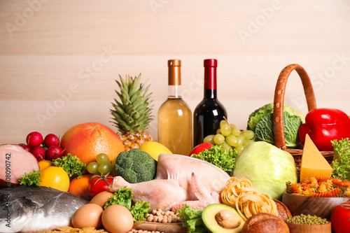 Fototapeta Naklejka Na Ścianę i Meble -  Different products on wooden background, closeup. Healthy food and balanced diet