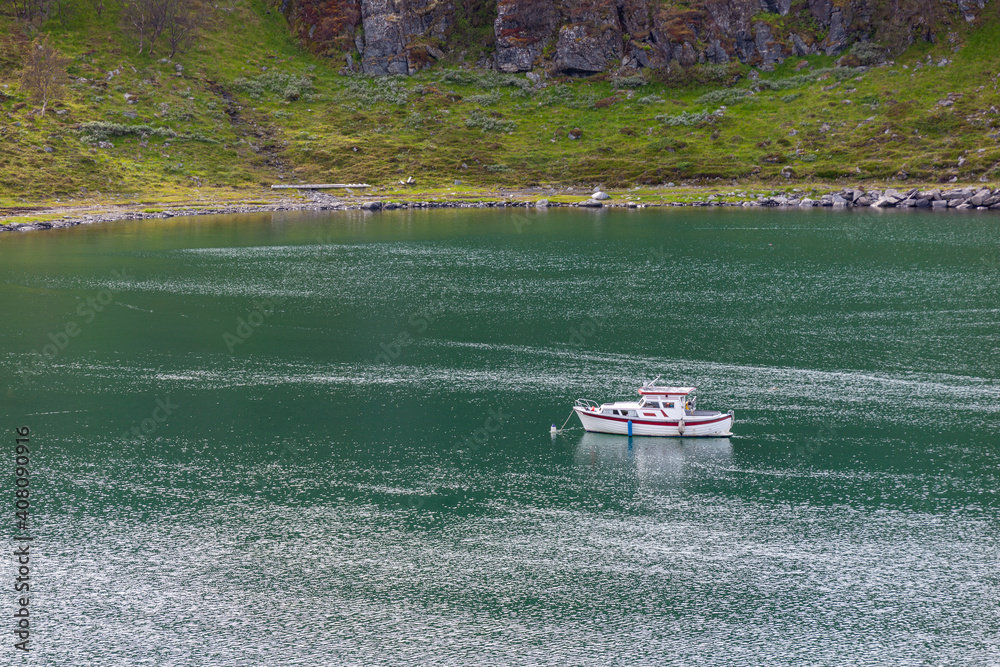 Φωτογραφία A beautiful summer landscape of the Porsanger Fjord of the Barents Sea with a white ship in turquoise sea water on the mountains background, Northern Norway