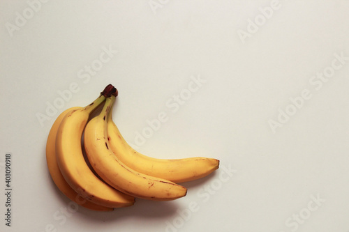 Flat lay of bananas on a white background