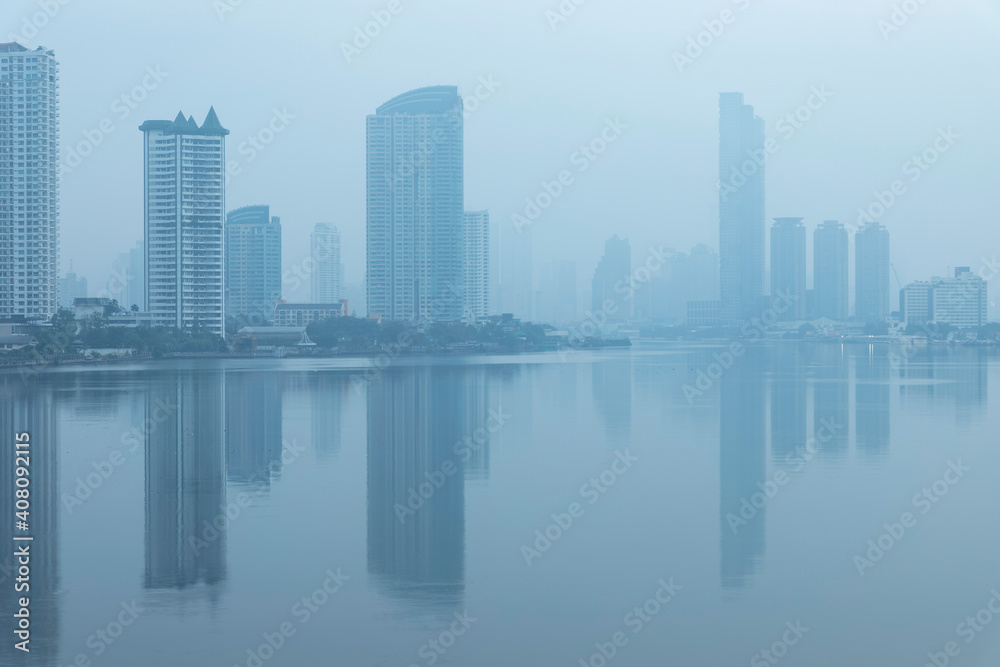 Bangkok office buildings and condominium with Chao Phraya river and chips. Office building under smog in Sathorn Bangkok. Smog PM 2.5 is a kind of air pollution. Bangkok City in the air pollution.
