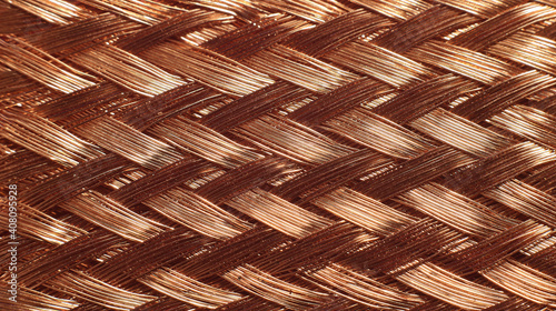 Braided copper wire strip close-up, flat lay top view.