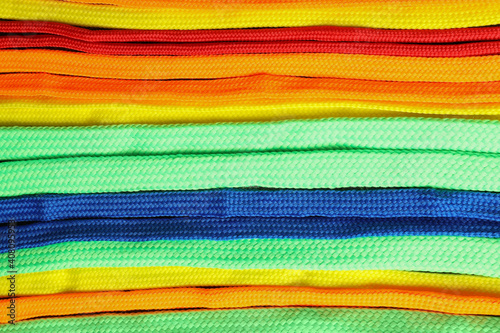 Colorful shoelaces as background, closeup. Stylish accessory