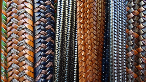 close-up photo of leather belts