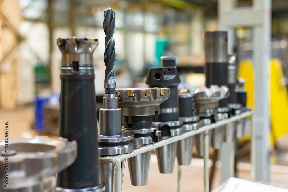 Accessories and tools for a CNC machine on a rack for equipment at a factory and enterprise. Accessories and tools for a CNC machine on a rack for equipment at a factory and enterprise.