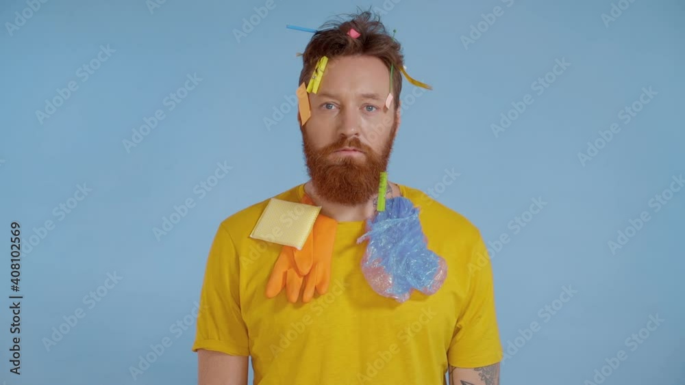 Portrait of bearded man with rubbish on himself. plastic garbage falling from above. Slowmotion. Portrait of bearded man with rubbish on himself. plastic garbage falling from above. Slowmotion.