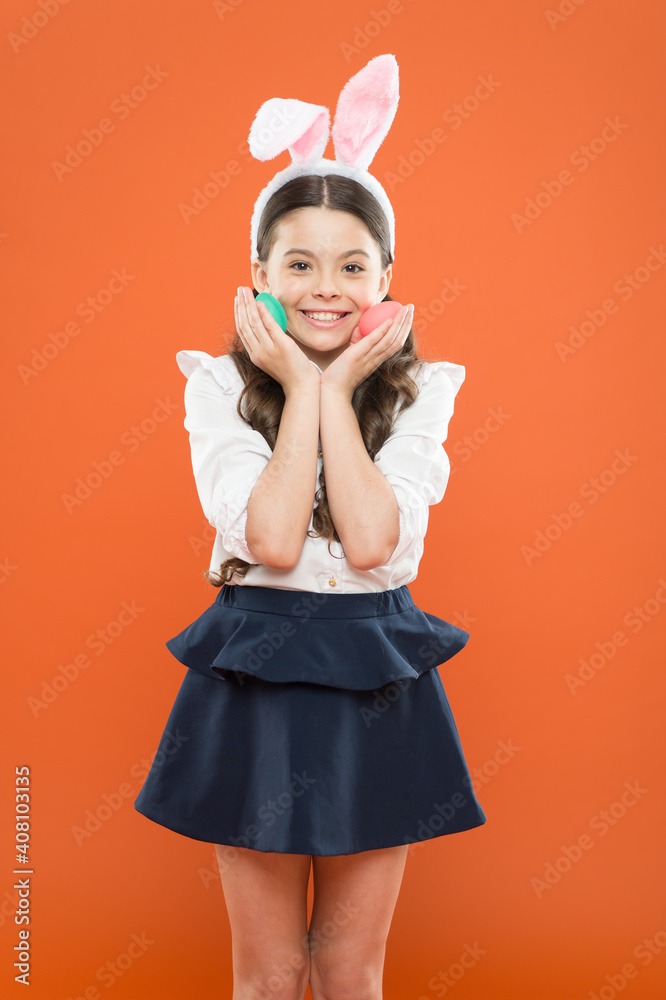 Little schoolgirl in rabbit ears. Easter eggs. Happy easter. Tradition of decorating eggs of all kinds. Small girl bunny ears. Kid on easter egg hunt. Adorable happy child hold eggs. Spring holiday Little schoolgirl in rabbit ears. Easter eggs. Happy easter. Tradition of decorating eggs of all kinds. Small girl bunny ears. Kid on easter egg hunt. Adorable happy child hold eggs. Spring holiday