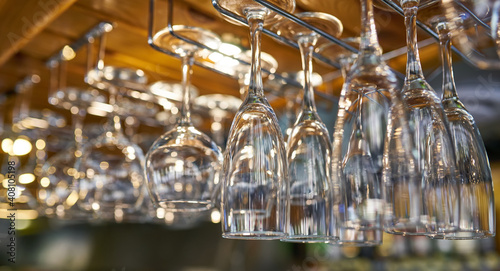 glasses for wine above a bar rack