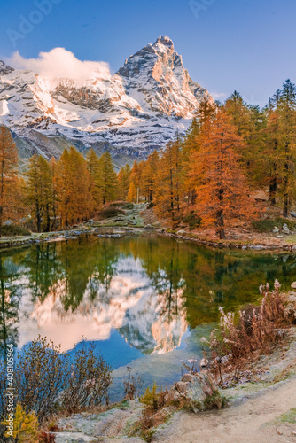 Blue Lake and the surroundings area during the fall and changing of the colors. Foliage  reflection and snowy peaks.