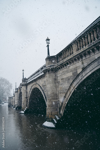 Richmond Bridge on cold snowy winter Sunday photo