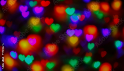 heart shape colorful light blurred for valentine's day background, colorful heart bokeh in dark night, glowing light with heart shape bokeh for abstract background