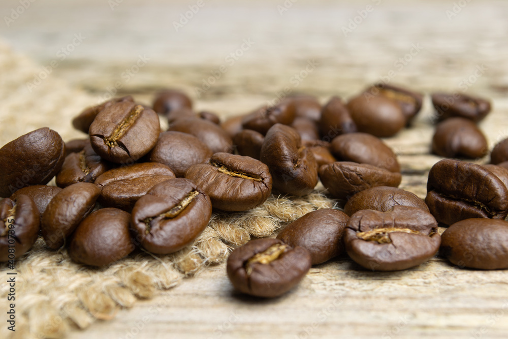 coffee beans on old natural wood background close up coffee beans on old natural wood background close up