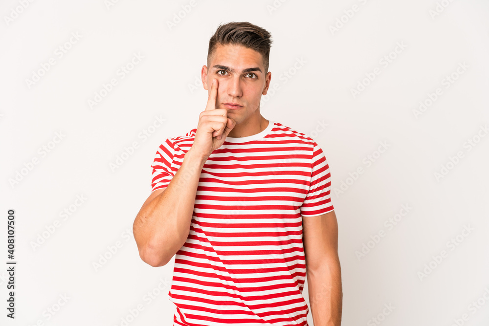 Young caucasian handsome man isolated showing number one with finger. Young caucasian handsome man isolated showing number one with finger.