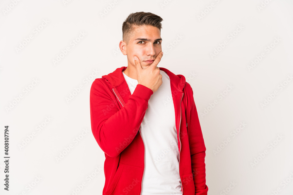 Young caucasian handsome man isolated contemplating, planning a strategy, thinking about the way of a business. Young caucasian handsome man isolated contemplating, planning a strategy, thinking about the way of a business.