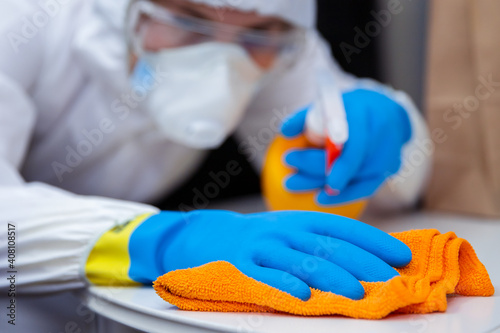 Disinfection, cleaning and washing of surface. COVID-19. Prevention of coronavirus infection. closeup of disinfecting surface by spraying sanitizer from bottle