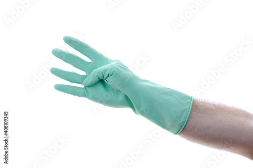 Fototapeta Naklejka Na Ścianę i Meble -  Man's hand in a green glove on hand shows four. Isolated on a white background. 